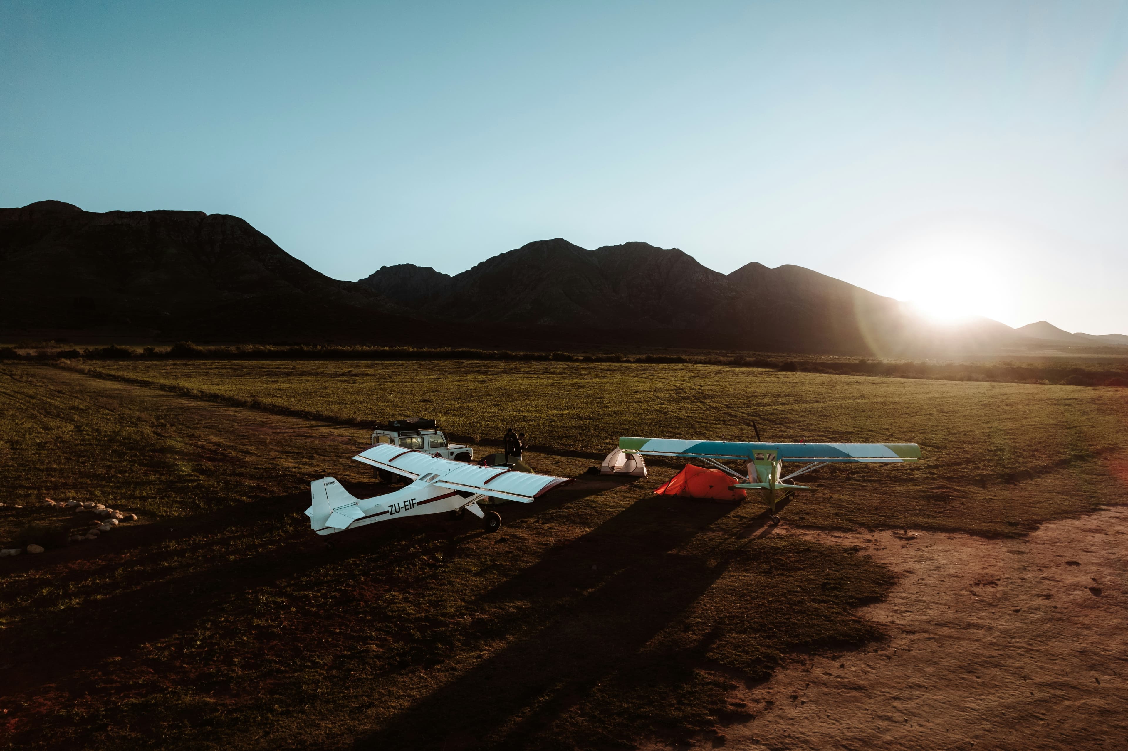 General aviation aircraft on the ramp at sunset